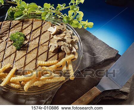 Grilled beef with French fries View Large Photo Image Stock Photograph - Grilled beef with French fries. Fotosearch