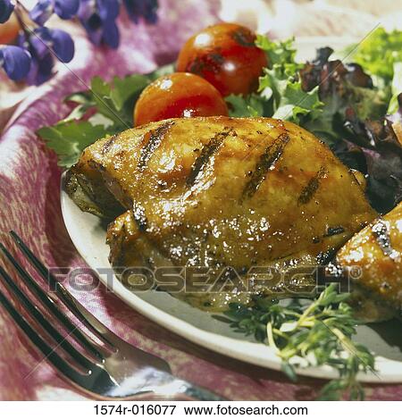 Stock Photo - Grilled meat served with salad. Fotosearch