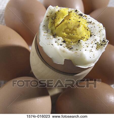 High angle view of a hard-boiled egg on top of raw eggs View Large Photo Image Stock Image - High angle view of a hard-boiled egg on top of raw eggs. Fotosearch