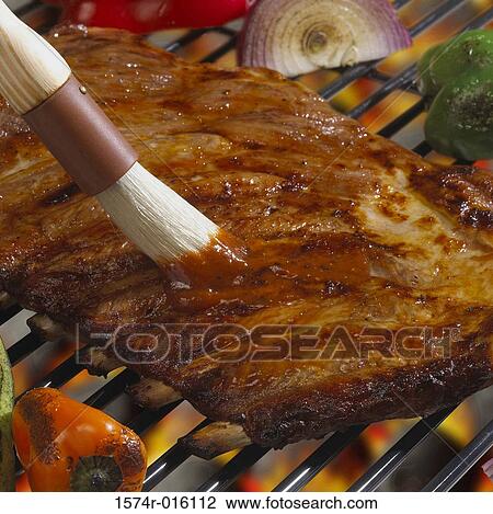 High angle view of a ribs cooked over a barbecue grill View Large Photo Image Stock Image - High angle view of a ribs cooked over a barbecue grill. Fotosearch