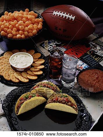 High angle view of crackers and dip near a plate of tacos View Large Photo Image Stock Image - High angle view of crackers and dip near a plate of tacos. Fotosearch