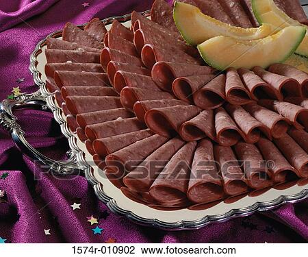 Stock Image - Salami on a serving tray. Fotosearch