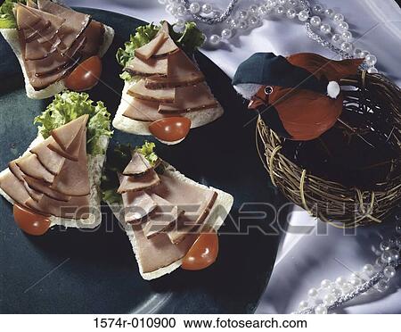 Stock Image - Slices of ham on bread. Fotosearch