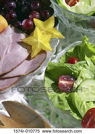 Close-up of a green salad served with sliced meat and fruits View Large Photo Image Stock Photography - Close-up of a green salad served with sliced meat and fruits. Fotosearch
