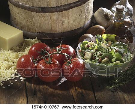 Close-up of tomatoes and cheese near a barrel View Large Photo Image Stock Photo - Close-up of tomatoes and cheese near a barrel. Fotosearch