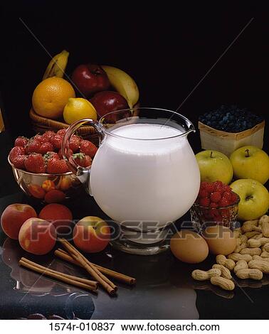 Fresh fruits and nuts served with a jug of milk View Large Photo Image Stock Photo - Fresh fruits and nuts served with a jug of milk. Fotosearch