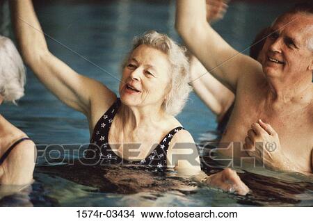 Group of senior people performing water aerobics in a swimming pool View Large Photo Image Picture - Group of senior people performing water aerobics in a swimming pool. Fotosearch