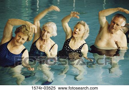 Stock Photography - Group of senior people stretching in a swimming pool. Fotosearch