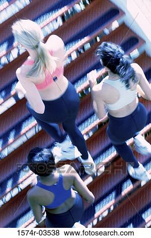 High angle view of three young women jogging View Large Photo Image Stock Photo - High angle view of three young women jogging. Fotosearch