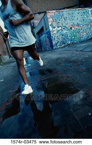 Stock Photography - Man jogging in the city. Fotosearch