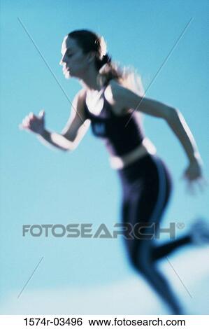 Stock Photograph - Young woman exercising. Fotosearch