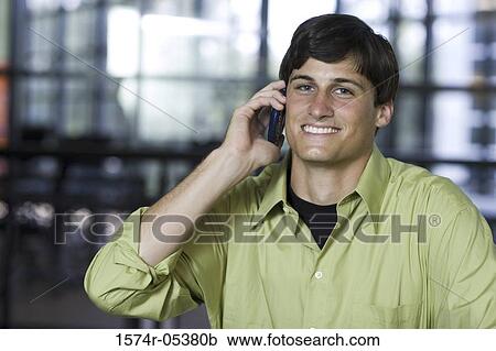Portrait of a businessman talking on a mobile phone View Large Photo Image Stock Image - Portrait of a businessman talking on a mobile phone. Fotosearch