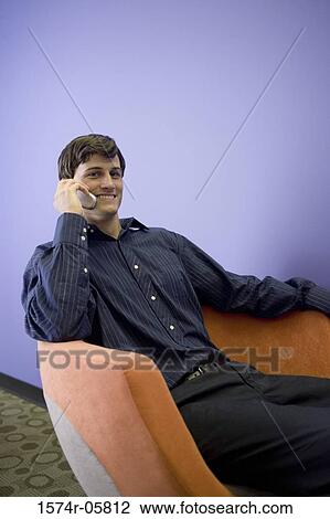 Portrait of a businessman talking on a mobile phone View Large Photo Image Stock Image - Portrait of a businessman talking on a mobile phone. Fotosearch