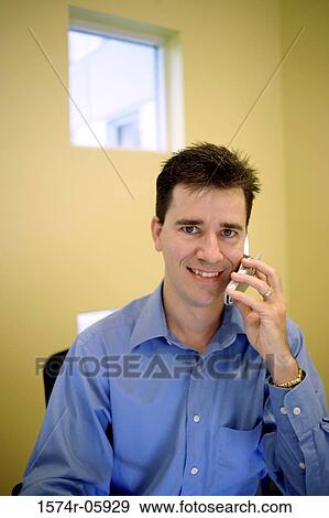 Portrait of a businessman talking on a mobile phone View Large Photo Image Stock Photo - Portrait of a businessman talking on a mobile phone. Fotosearch