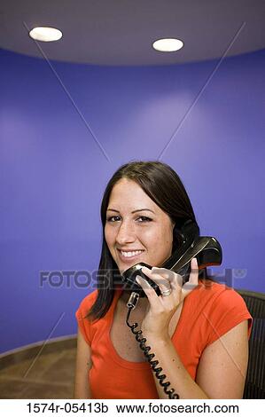Portrait of a businesswoman talking on a telephone View Large Photo Image Stock Image - Portrait of a businesswoman talking on a telephone. Fotosearch