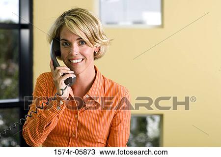 Portrait of a businesswoman talking on a telephone View Large Photo Image Stock Image - Portrait of a businesswoman talking on a telephone. Fotosearch
