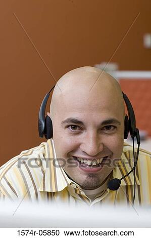 Portrait of a male customer service representative wearing a headset View Large Photo Image Stock Image - Portrait of a male customer service representative wearing a headset. Fotosearch