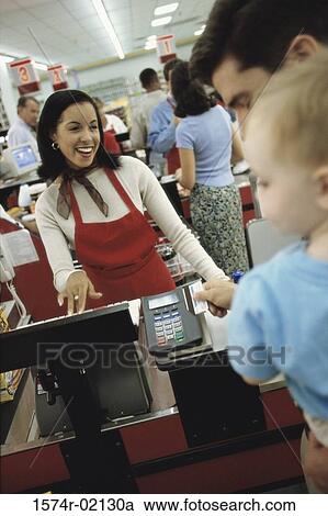 Father and his son at a checkout counter in a supermarket View Large Photo Image Stock Image - Father and his son at a checkout counter in a supermarket. Fotosearch