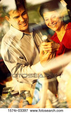 Mature couple in a department store View Large Photo Image Stock Photo - Mature couple in a department store. Fotosearch