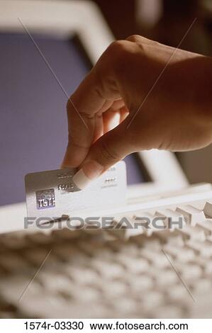 Person's hand swiping a credit card View Large Photo Image Stock Image - Person's hand swiping a credit card. Fotosearch