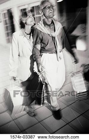 Senior couple in a shopping mall View Large Photo Image Stock Photo - Senior couple in a shopping mall. Fotosearch