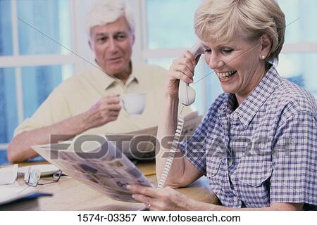 Stock Photo - Senior woman talking on a telephone. Fotosearch