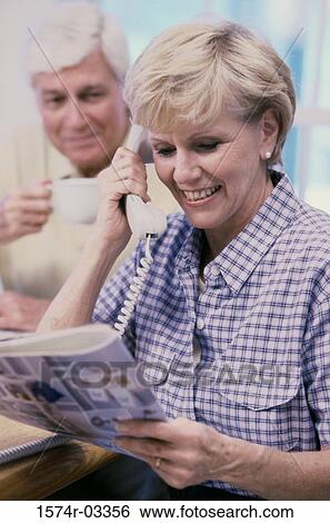 Senior woman talking on a telephone View Large Photo Image Stock Photograph - Senior woman talking on a telephone. Fotosearch