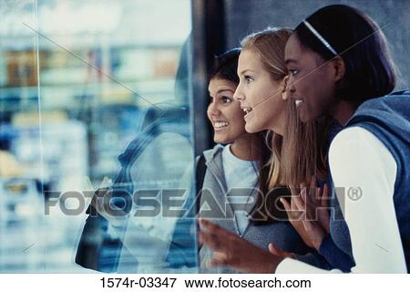 Three teenage girls shopping View Large Photo Image Stock Photo - Three teenage girls shopping. Fotosearch