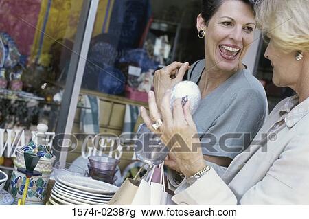 Two mature women shopping in a store View Large Photo Image Stock Image - Two mature women shopping in a store. Fotosearch