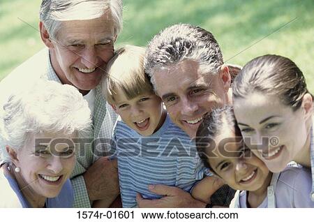 Stock Image - Close-up of a family smiling. Fotosearch