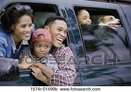 Family together in a vehicle looking out smiling View Large Photo Image Stock Image - Family together in a vehicle looking out smiling. Fotosearch