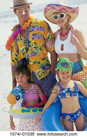 Father and mother with their children at the beach View Large Photo Image Stock Photo - Father and mother with their children at the beach. Fotosearch