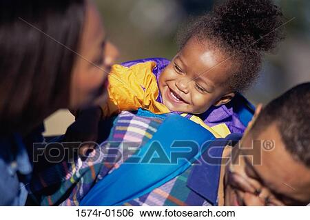 Father carrying his daughter on his back View Large Photo Image Stock Photograph - Father carrying his daughter on his back. Fotosearch
