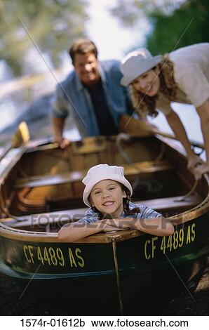 Parents and their daughter in a rowboat View Large Photo Image Stock Image - Parents and their daughter in a rowboat. Fotosearch