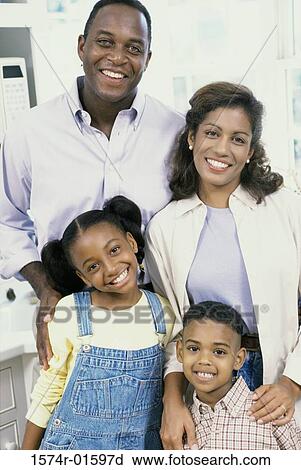Stock Image - Portrait of a couple with their son and daughter. Fotosearch