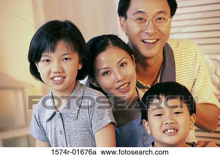 Portrait of a couple with their son and daughter View Large Photo Image Stock Image - Portrait of a couple with their son and daughter. Fotosearch