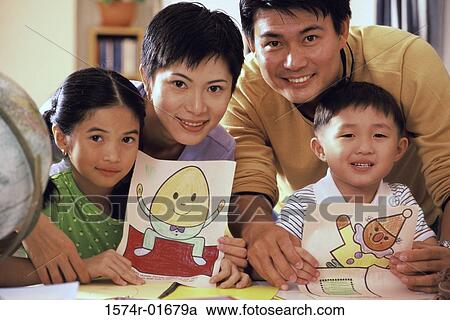 Portrait of a couple with their son and daughter View Large Photo Image Stock Image - Portrait of a couple with their son and daughter. Fotosearch