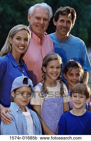 Portrait of a family standing together View Large Photo Image Stock Image - Portrait of a family standing together. Fotosearch