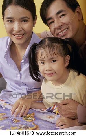 Portrait of parents and their daughter View Large Photo Image Stock Photo - Portrait of parents and their daughter. Fotosearch
