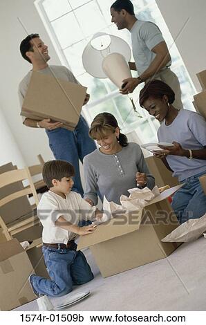 Two young couples unpacking boxes in a new home View Large Photo Image Stock Image - Two young couples unpacking boxes in a new home. Fotosearch