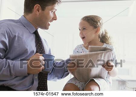 Stock Photo - Young businessman talking to his daughter. Fotosearch