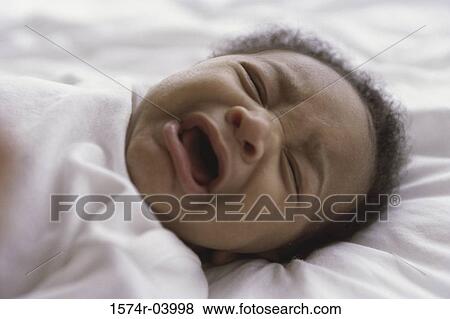 Close-up of a baby boy crying View Large Photo Image Stock Photo - Close-up of a baby boy crying. Fotosearch