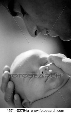 Close-up of a father carrying his baby boy View Large Photo Image Stock Image - Close-up of a father carrying his baby boy. Fotosearch