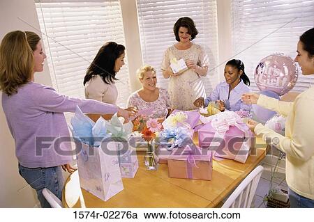 Stock Image - Group of young women at a baby shower. Fotosearch