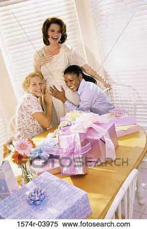 Stock Photography - Group of young women at a baby shower. Fotosearch