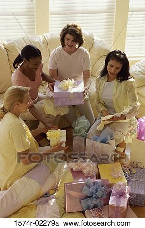 Group of young women sitting together at a baby shower View Large Photo Image Stock Image - Group of young women sitting together at a baby shower. Fotosearch
