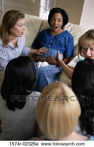 Group of young women sitting together at a baby shower View Large Photo Image Stock Image - Group of young women sitting together at a baby shower. Fotosearch