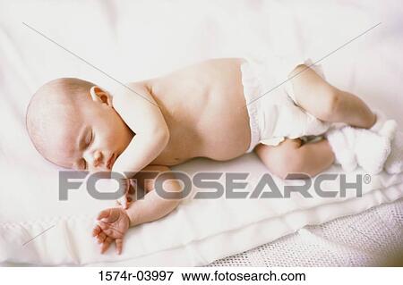 High angle view of a baby boy sleeping View Large Photo Image Stock Photo - High angle view of a baby boy sleeping. Fotosearch
