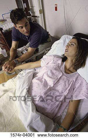 Husband holding his pregnant wife's hand View Large Photo Image Stock Image - Husband holding his pregnant wife's hand. Fotosearch