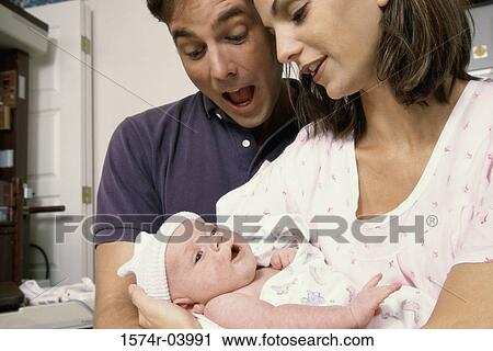 Parents carrying their baby boy View Large Photo Image Stock Image - Parents carrying their baby boy. Fotosearch